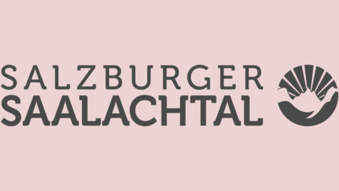 Logo_Saalachtal Logo für das Salzburger Saalachtal mit dem Text und einem Symbol, das eine über den Bergen aufgehende Sonne darstellt.