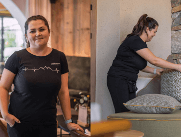 stubenmaedchen-sabrina Eine Frau steht vor einer Mauer.