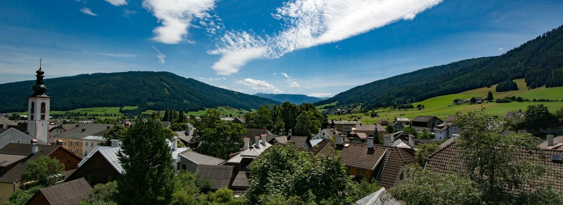 View over the wooden roofs of houses in Mauterndorf in summer