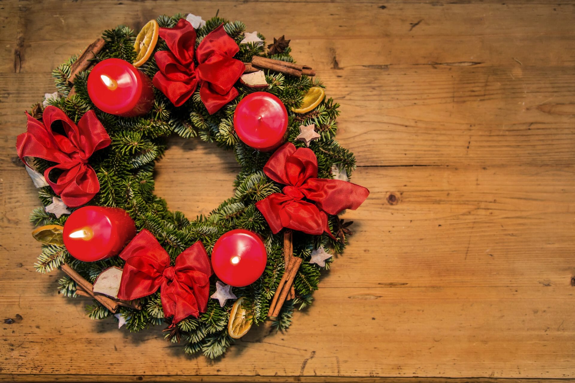 traditional red advent wreath with 4 candles