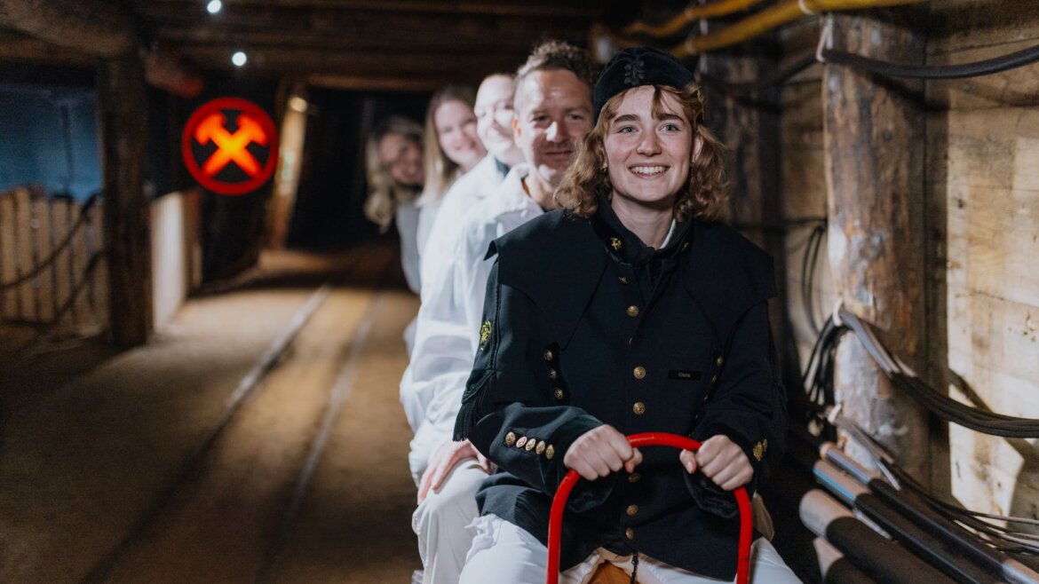 Visitors in mining attire enter the salt tunnels at Saltmine Salzburg with the traditional Grubenhunt. (Enlarged view)