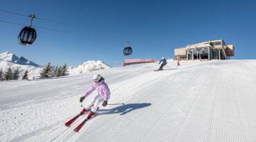 two skiers on perfect slopes