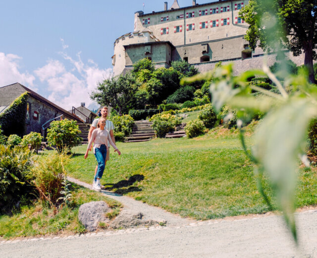 Young couple in front of Castle Hohenwerfen