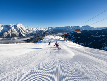 Freshly groomed slopes are perfect for gliding down into the valley.