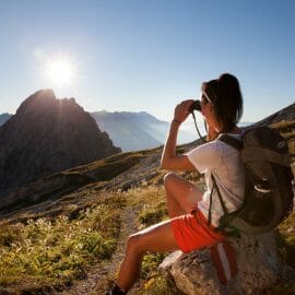 Hiker enjoying sunset at Salzburger Almenweg trail