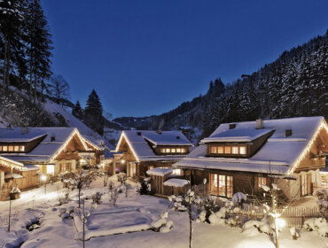Holzlebn Chalet Village in a deep winter wonderland at night