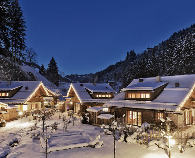 Hüttendorf Holzlebn Chalet Village in a deep winter wonderland at night