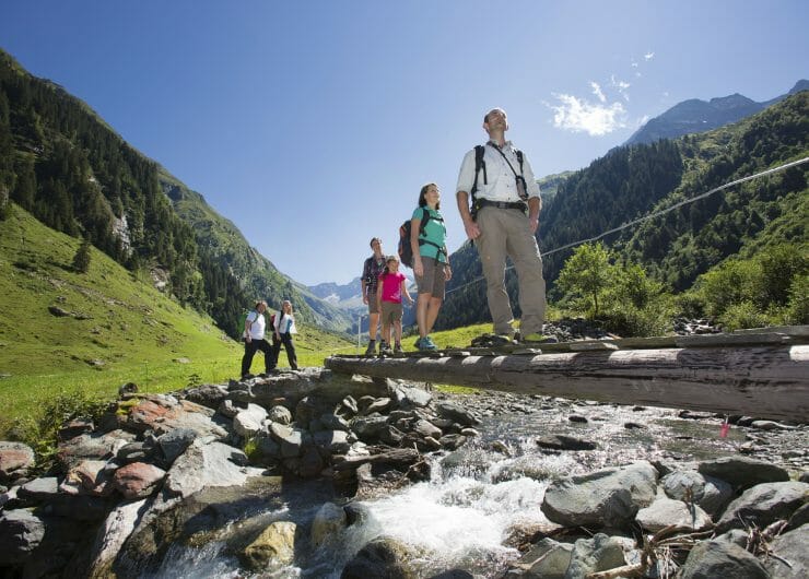 national park ranger guides a family through national park Hohe Tauern