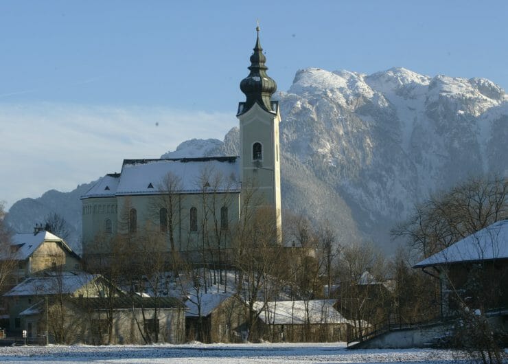 a castle on top of a snow covered mountain