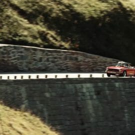 a car traveling on the side of the mountain