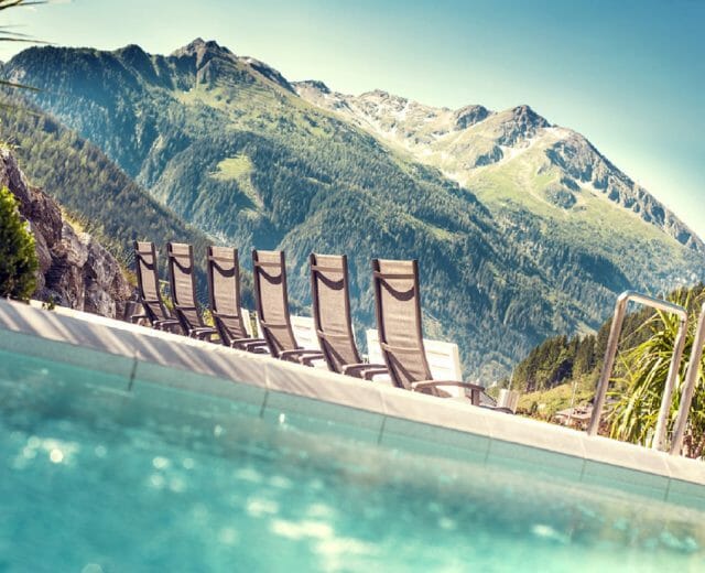 Felsentherme a view of a pool and a mountain in the back