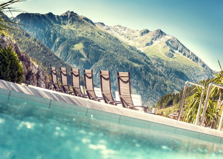 a view of a pool and a mountain in the back