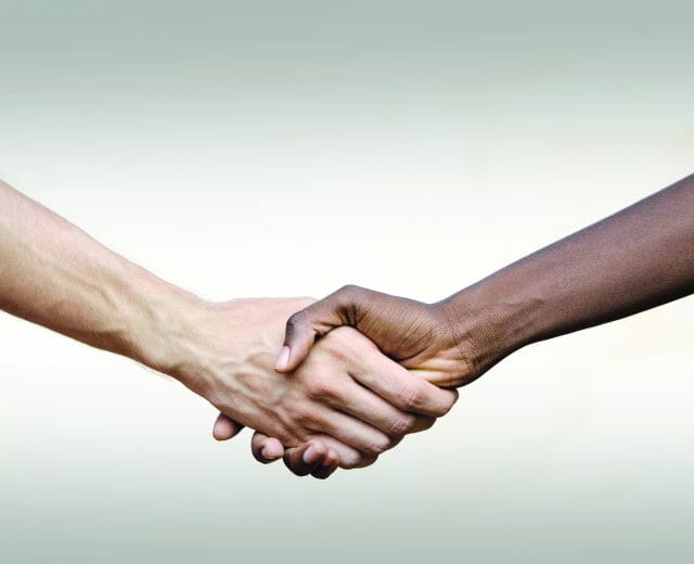 Black Civil Rights Symbol: Multi-Ethnic Handshake Africa