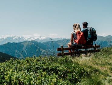 a person sitting on top of a mountain