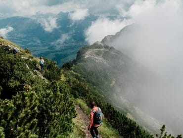 a man riding on top of a mountain