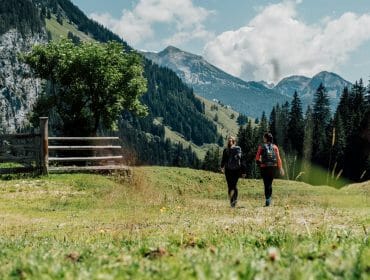 a person standing on top of a grass covered field