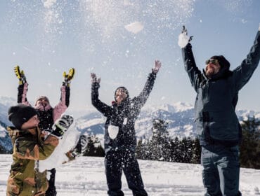 Family having fun in the snow