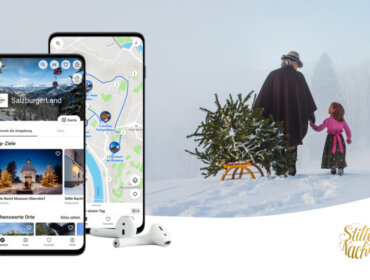 mobile with smart guide and an old man drawing a sledge with a christmas tree accompanied by child